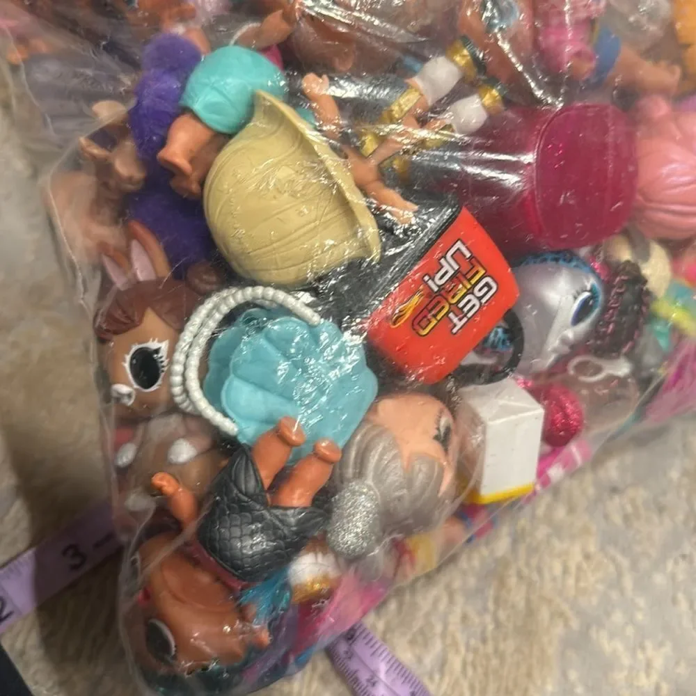 Almost 5lb of Lol dolls , dolls accessories , clothes and some furniture big lot